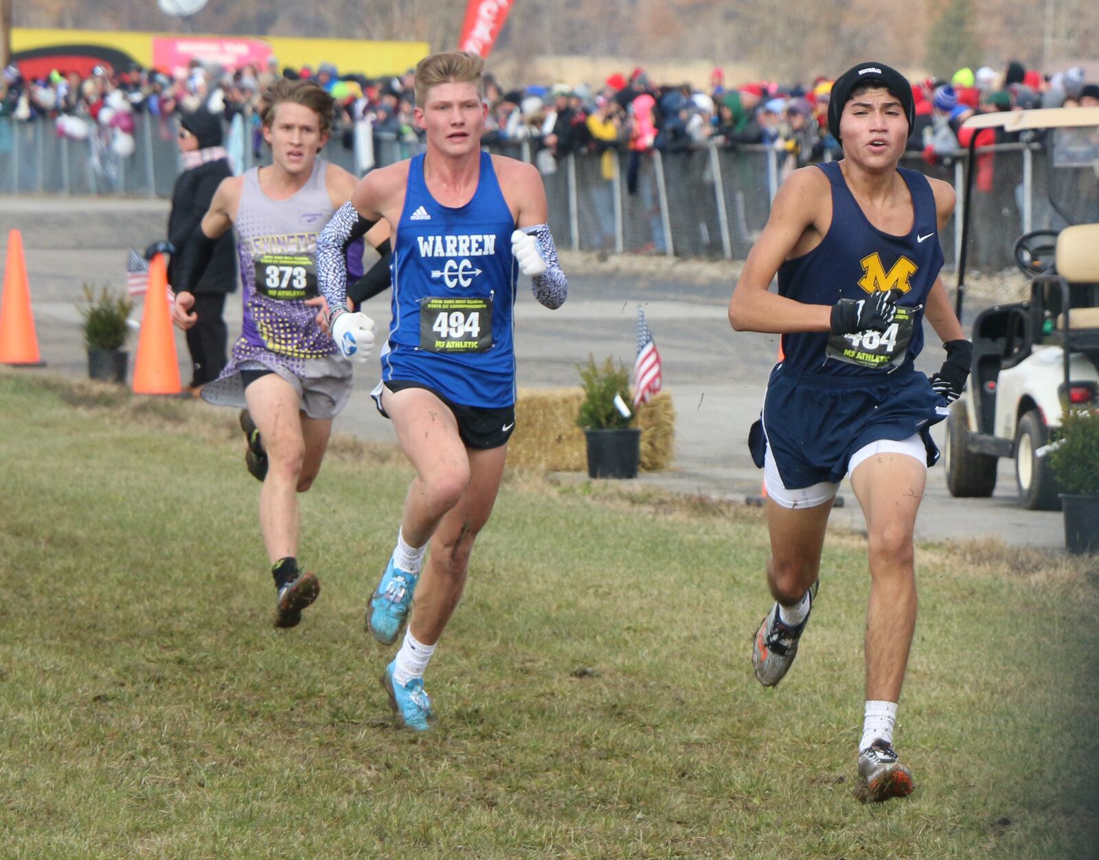 Monroe’s Marty Zumbiel (right) competes during the Division II state cross country championship race Saturday at National Trail Raceway in Hebron. CONTRIBUTED PHOTO BY GREG BILLING