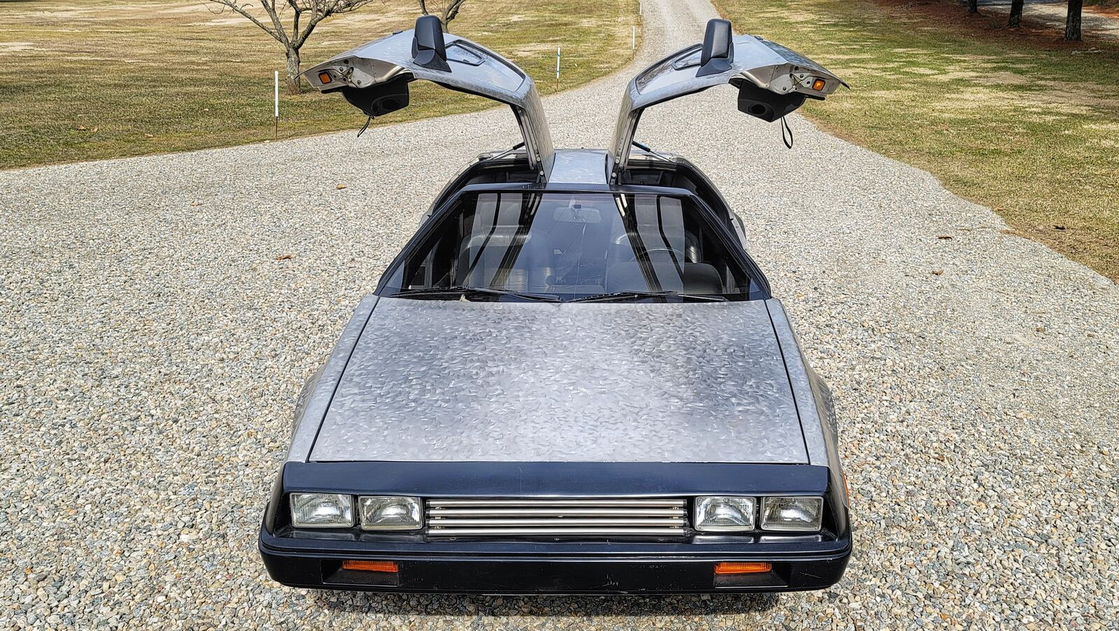Jim Bridges is selling his 1981 DeLorean he has owned since the mid-1980s. The car has just over 17,300 original miles on it and has a custom finish Bridges did himself to match a stainless steel jeep he built. NICK GRAHAM / STAFF