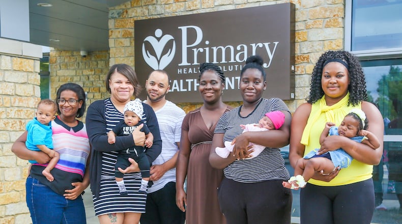 Mary Lockhart, Charman Hill, Nicholas Hill, Grace Eshun, Tiara Thomas and Sjone Hall, along with their children, took part n a PRIM Community Action Team event outside Primary Health Solutions Health Center in Middletown, Tuesday, Aug. 29, 2017. Th PRIM team - consisting of local community leaders, Pastors, advocates and concerned citizens are working together to combat Infant Mortality. GREG LYNCH / STAFF