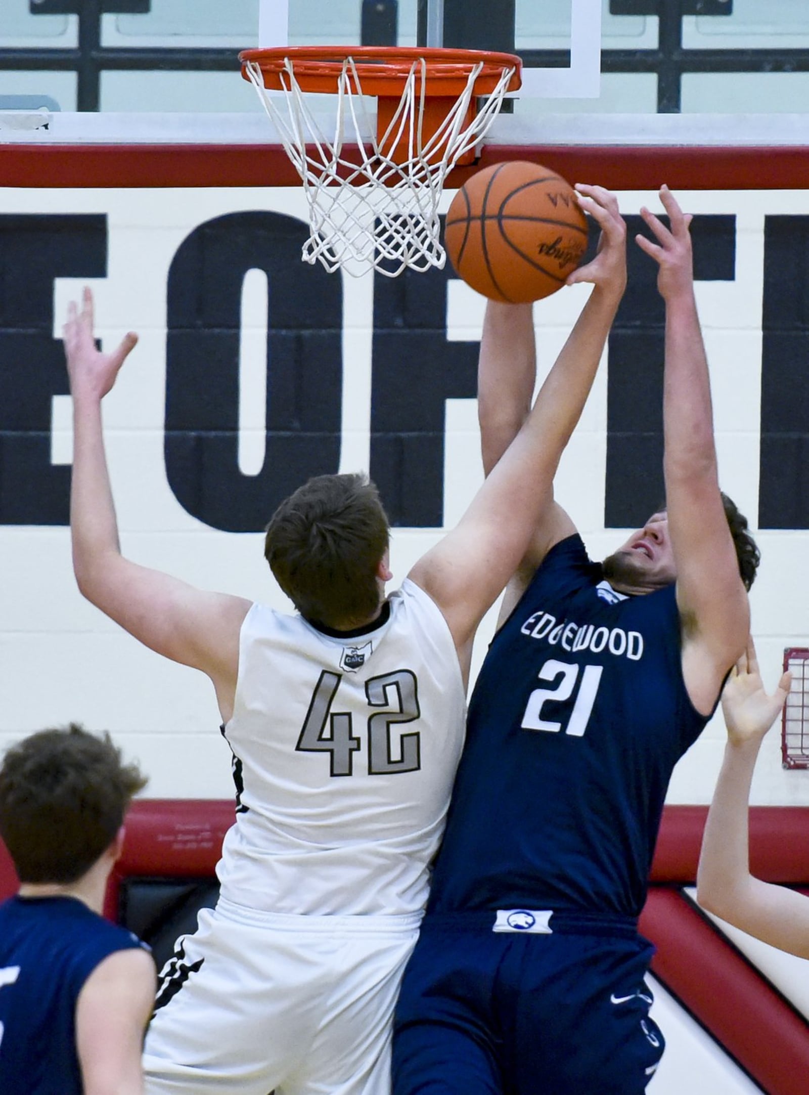 Edgewood’s Tanner Wright and Lakota East’s Alex White (42) fight for a rebound during a Division I sectional game Feb. 27, 2015, at Lakota West. East won 78-40. NICK GRAHAM/ STAFF