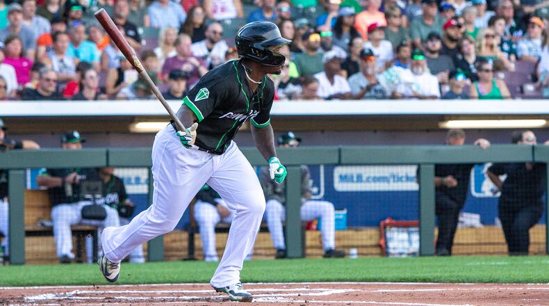 Cam Collier singles during game last season with the Dayton Dragons at Day Air Ballpark. Jeff Gilbert/CONTRIBUTED