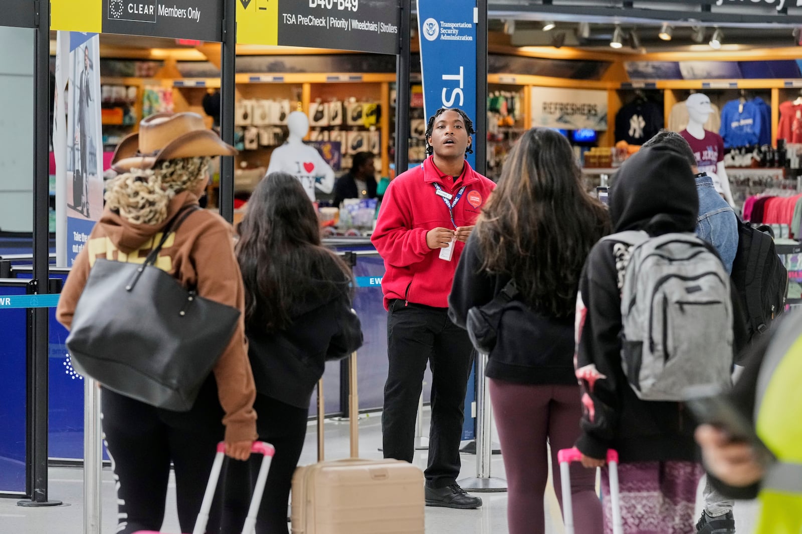 Passengers approach a TSA checkpoint at Newark Liberty International Airport, in New Jersey, Friday, May 23, 2025. (AP Photo/Richard Drew)