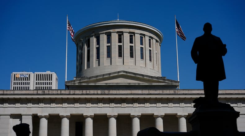 The William McKinley Monument is silhouetted in front of the west side of the Ohio Statehouse, Monday, April 15, 2024, in Columbus. (AP Photo/Carolyn Kaster, File)