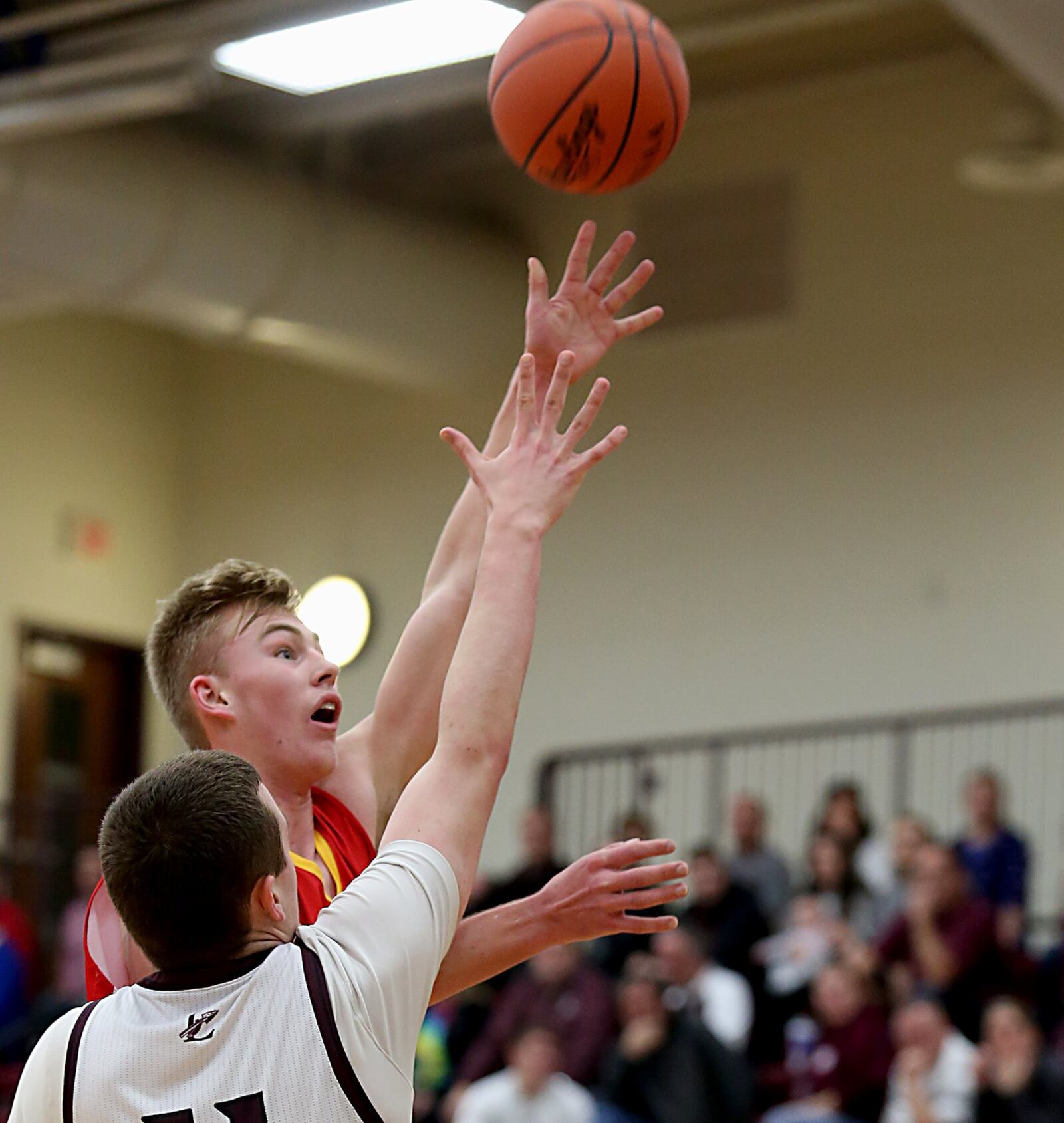 Fenwick forward C.J. Napier shoots over Lebanon forward Zach Huffman during Saturday night’s game at Lebanon. CONTRIBUTED PHOTO BY E.L. HUBBARD