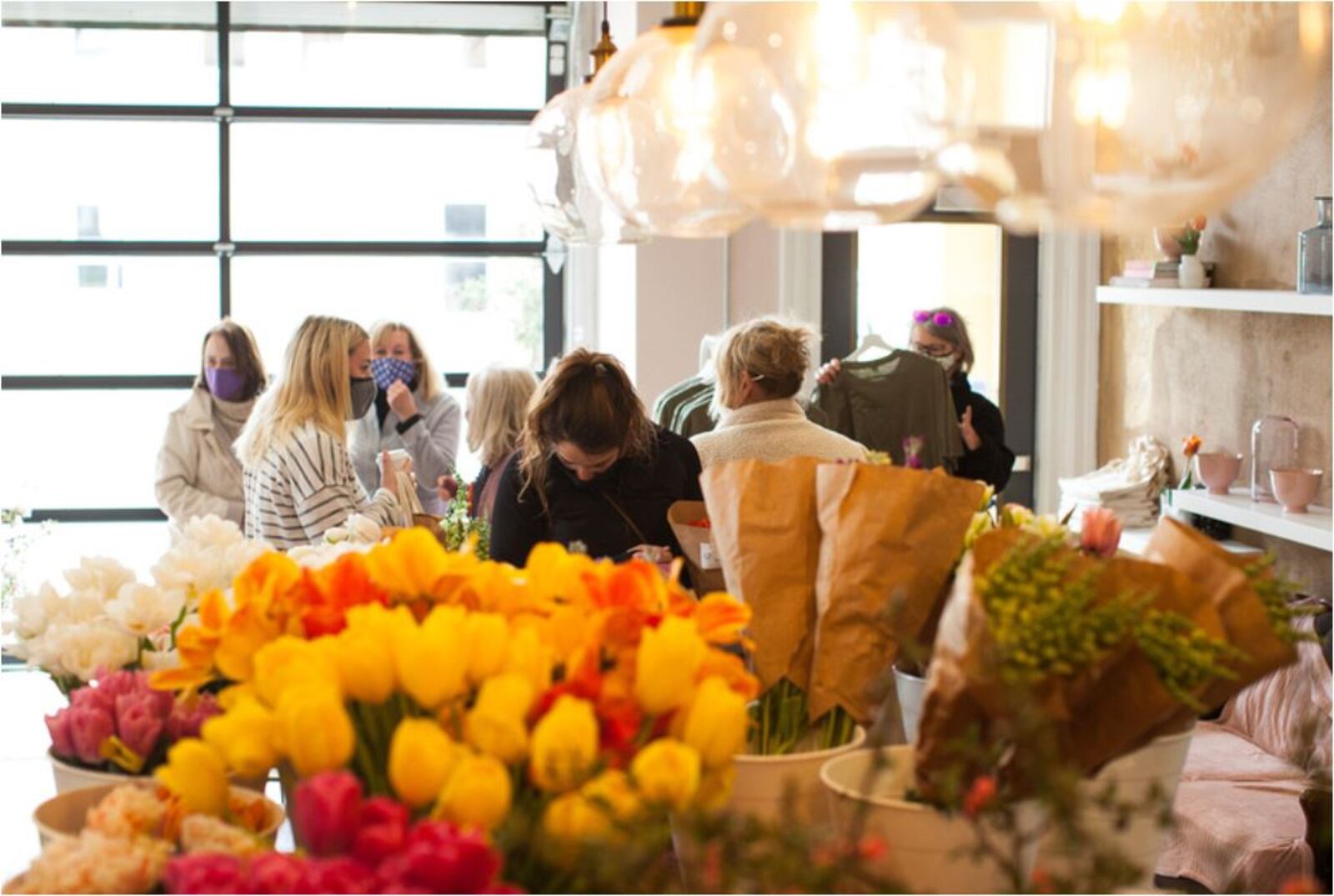 People gathered at a recent Farmer's Collective event at the Two Little Buds flower shop. PROVIDED