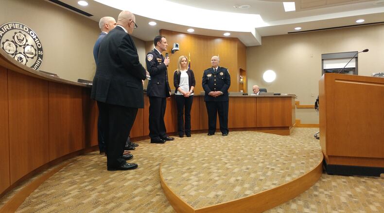 Steve Maynard (center) talks to the crowd after taking the oath of office on Feb. 26, 2018, to be the next Fairfield Police Chief. Fairfield City Councilman Ron D’Epfianio, City Manager Mark Wendling and Mayor Steve Miller, respectively, are to Maynard’s left, and his wife Ashley and former Police Chief Mike Dickey are to his right. JENNY DEXTER/CONTRIBUTED