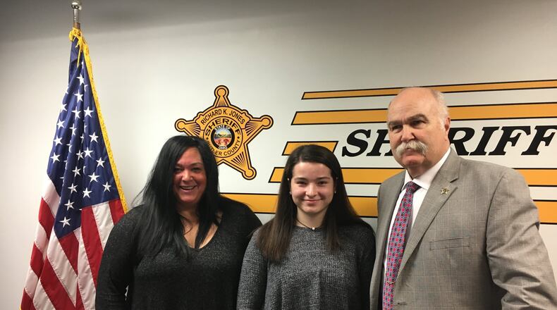 Patty Scott (left) poses with her daughter, Erika Scott, (center) and Butler County Sheriff Richard K. Jones at a press conference held Thursday morning. Erika discussed concerns regarding school safety in light of the recent incident in Parkland, Florida.