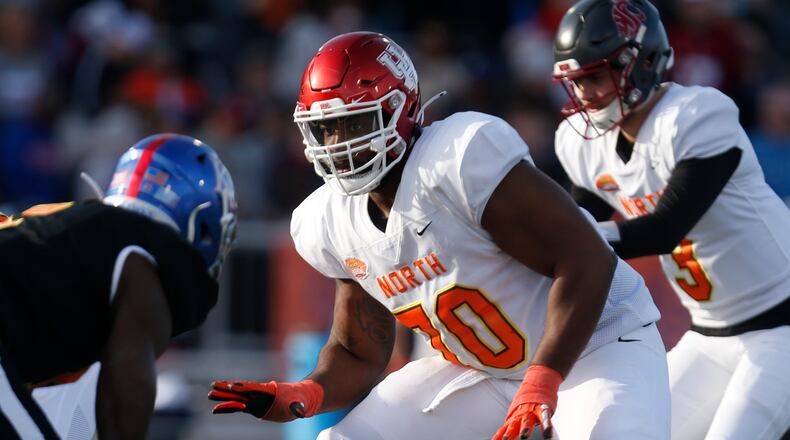 FILE - In this Jan. 25, 2020, file photo, North offensive tackle Josh Jones of Houston (70) is shown playing during the second half of the Senior Bowl college football game in Mobile, Ala. Josh Jones is a possible pick in the NFL Draft which runs Thursday, April 23, 2020, thru Saturday, April 25. (AP Photo/Butch Dill)