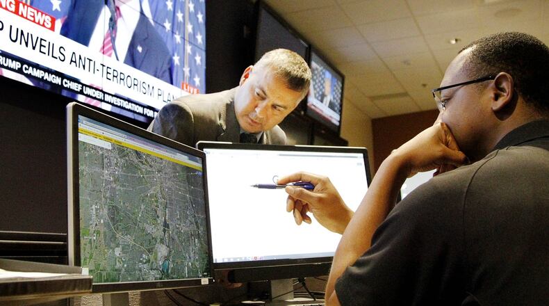 Brian Quinn, chief of operations at the Statewide Terrorism Analysis and Crime Center, is seen with an analyst. Created in 2005, the center located in Columbus is Ohio’s primary fusion center designed to keep Ohioans safe. Officials say Ohio couldn’t have a false alarm like the one that occurred in Hawaii over the weekend. CHRIS STEWART / STAFF