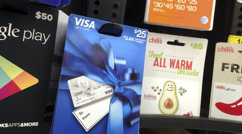 Gift cards are displayed at a store. ELISE/AMENDOLA/AP PHOTO