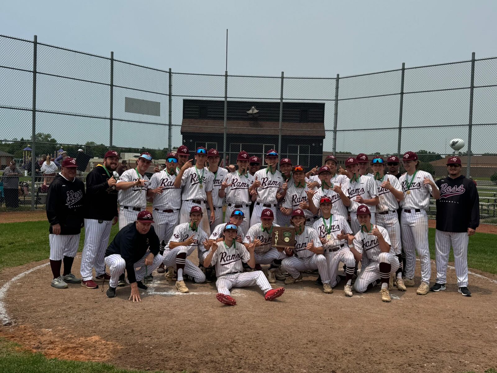 The Ross High School baseball team poses for pictures after capturing a Division III district title on Saturday. CONTRIBUTED