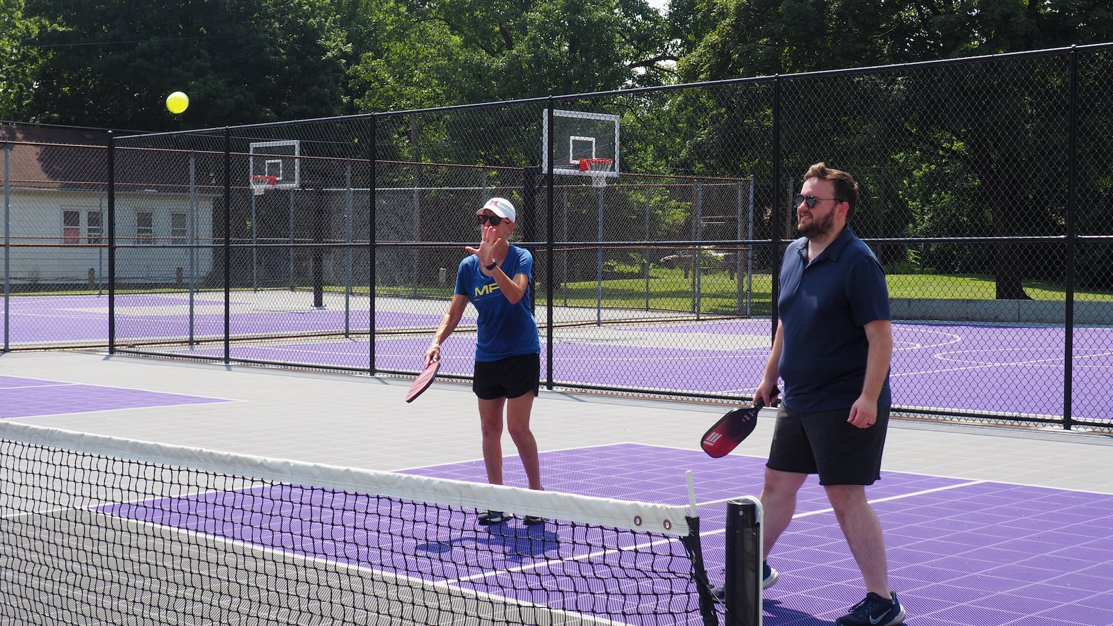 Sharon Hall and Middletown communications manager Clayton Castle play pickleball at Oakland Park's reopening community picnic on July 24, 2025. BRYN DIPPOLD/STAFF
