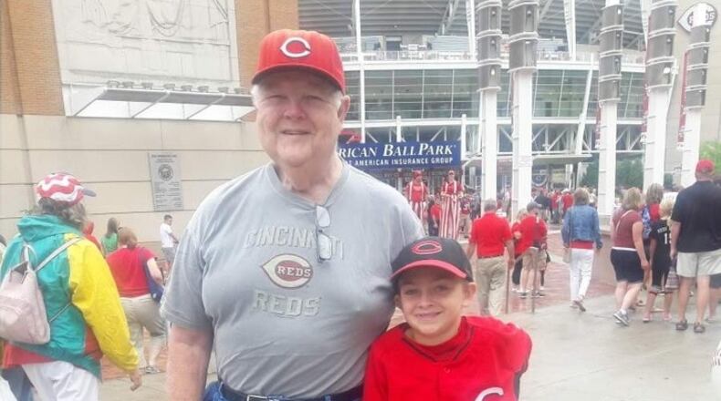 Justin Holweger, of Middletown, attends a Cincinnati Reds game with Luke Holweger, his youngest grandson. Luke now is a junior at Springboro High School and plays on the baseball team. Holweger called his five grandchildren his "Fab 5." SUBMITTED PHOTO