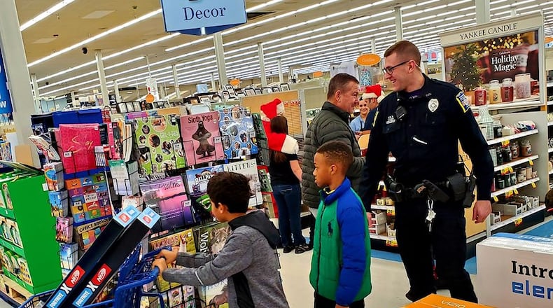 About 70 local children were allowed to spend $100 on “whatever they wanted” for Christmas during the annual Mike Davis Shop with a Cop program in Middletown. SUBMITTED PHOTO