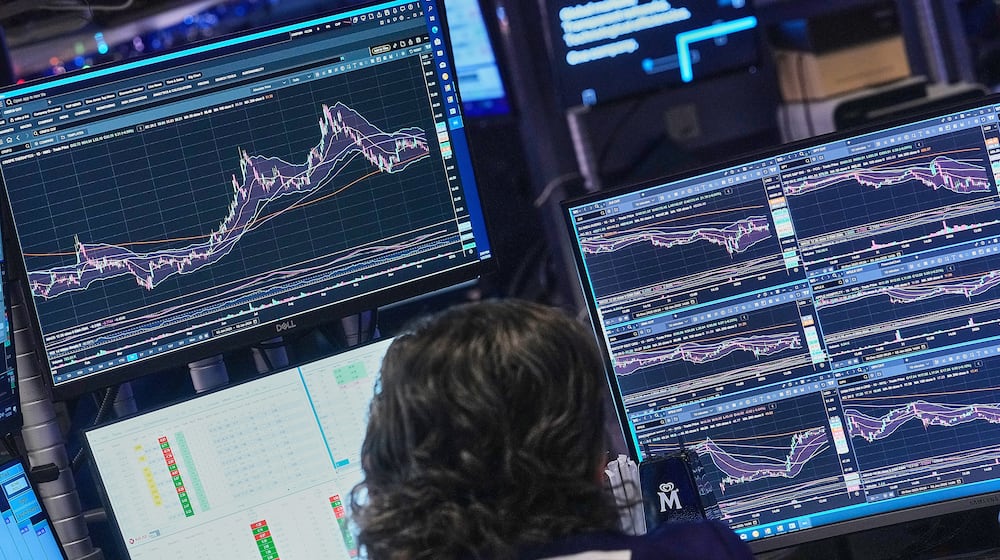 Specialist Michael Pistillo works at his post on the floor of the New York Stock Exchange, Friday, Jan. 2, 2026. (AP Photo/Richard Drew)