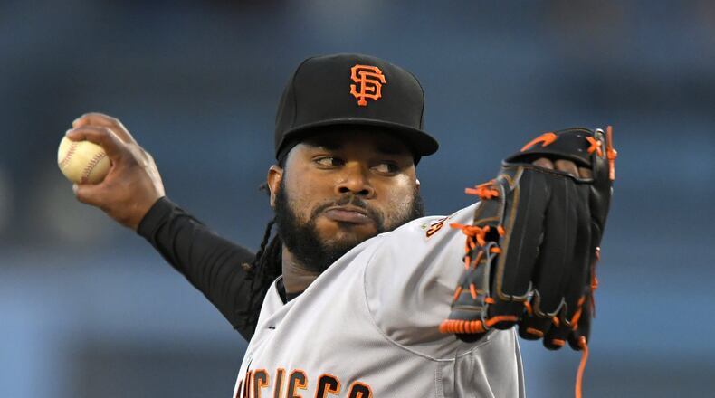 San Francisco Giants starting pitcher Johnny Cueto throws to the plate during the first inning of a baseball game against the Los Angeles Dodgers, Monday, May 1, 2017, in Los Angeles. (AP Photo/Mark J. Terrill)