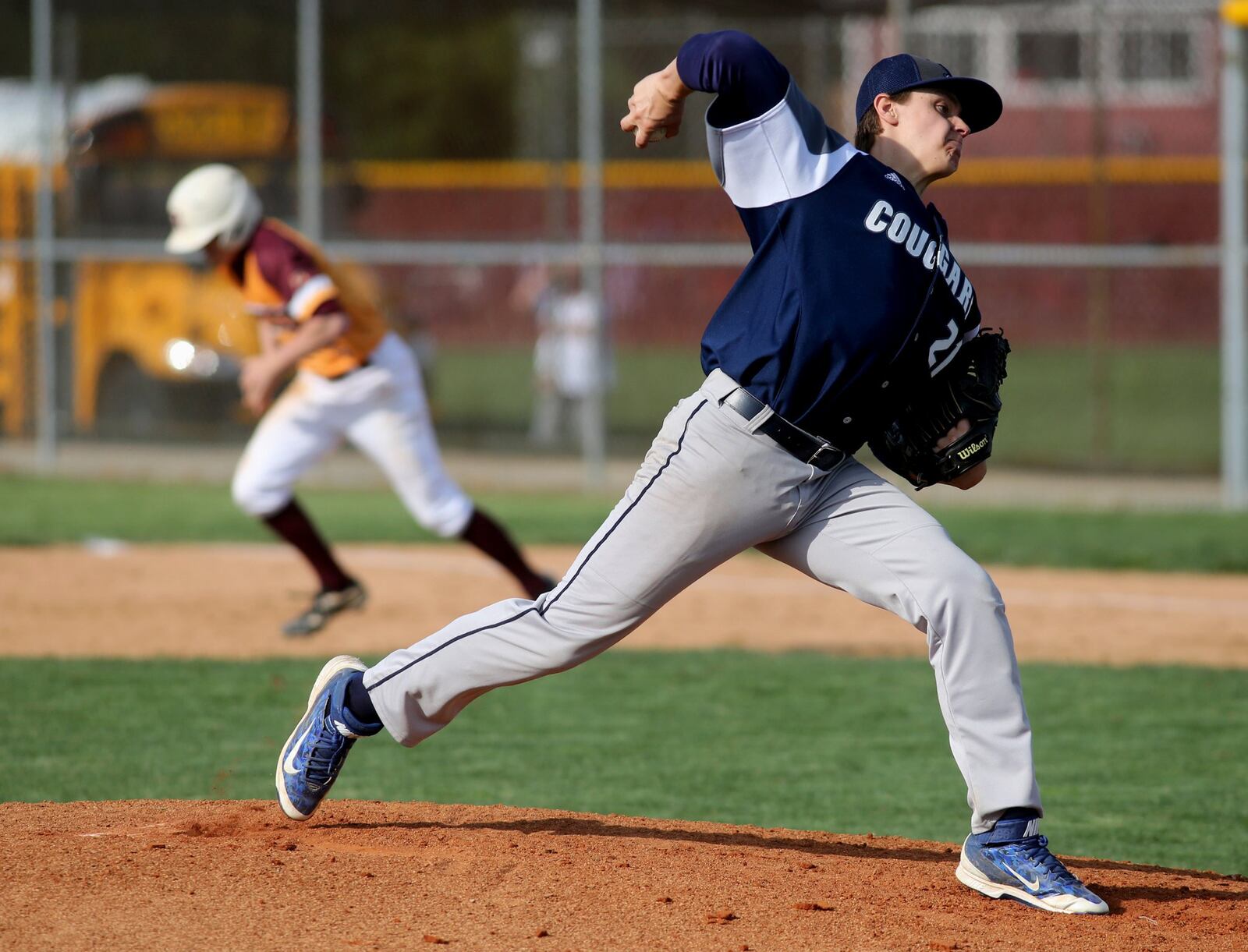 Edgewood’s Sam Muse throws a pitch as Logan Brofft of Ross takes off for second base during Wednesday’s game at Ross. CONTRIBUTED PHOTO BY E.L. HUBBARD