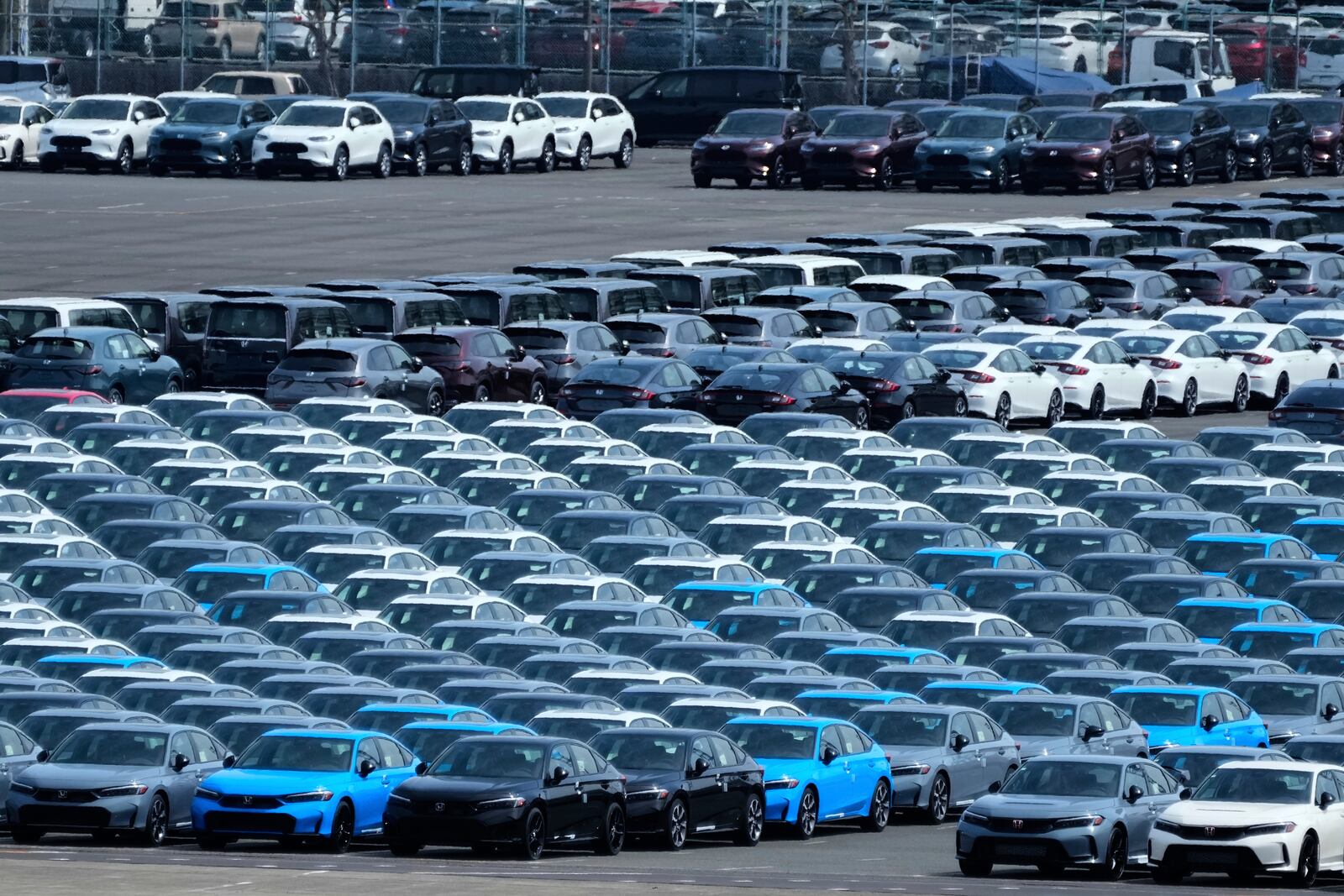 Export vehicles are parked at Daikoku Pier in Yokohama, near Tokyo, Tuesday, April 8, 2025. (AP Photo/Hiro Komae)