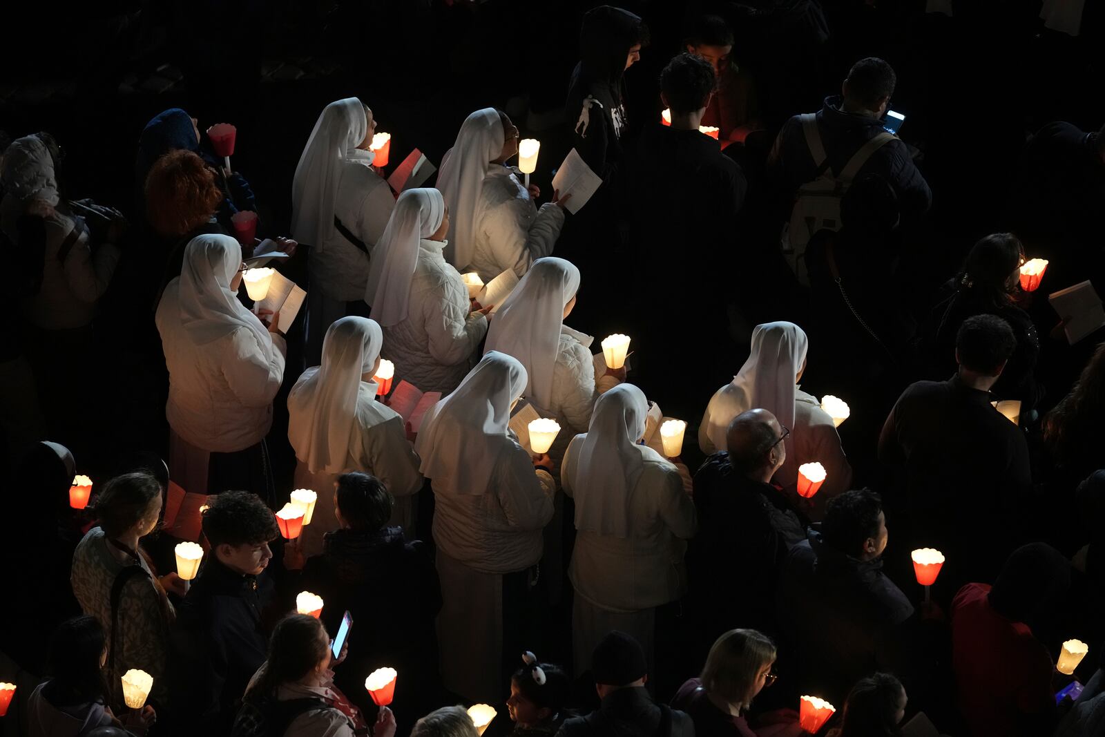 Nuns attend the procession outside the Colosseum during the Via Crucis (Latin for 'way of the cross') in Rome, Friday, April 18, 2025. (AP Photo/Andrew Medichini)