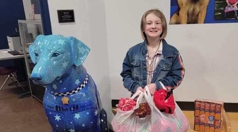 Abby Tucker, 10, a fifth-grader at Mayfield Elementary School in Middletown, used some of her Christmas money to buy blankets and food for the homeless. She dropped the items off this week at the Middletown police department. SUBMITTED PHOTO