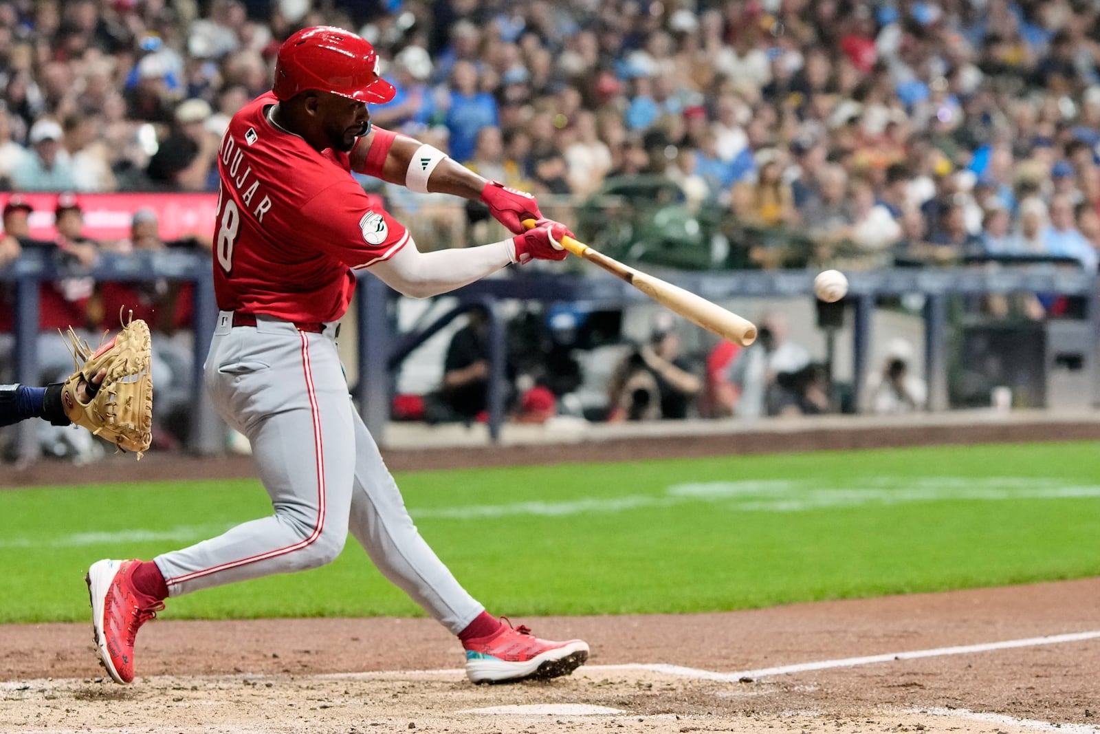 Cincinnati Reds' Miguel Andujar hits a double during the third inning of a baseball game against the Milwaukee Brewers Saturday, Sept. 27, 2025, in Milwaukee. (AP Photo/Morry Gash)