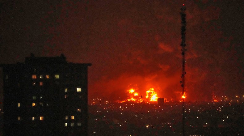 Flames rise from an oil storage facility south of the capital Tehran as strikes hit the city during the U.S.–Israel military campaign, Iran, Saturday, March 7, 2026. (AP Photo/Vahid Salemi)