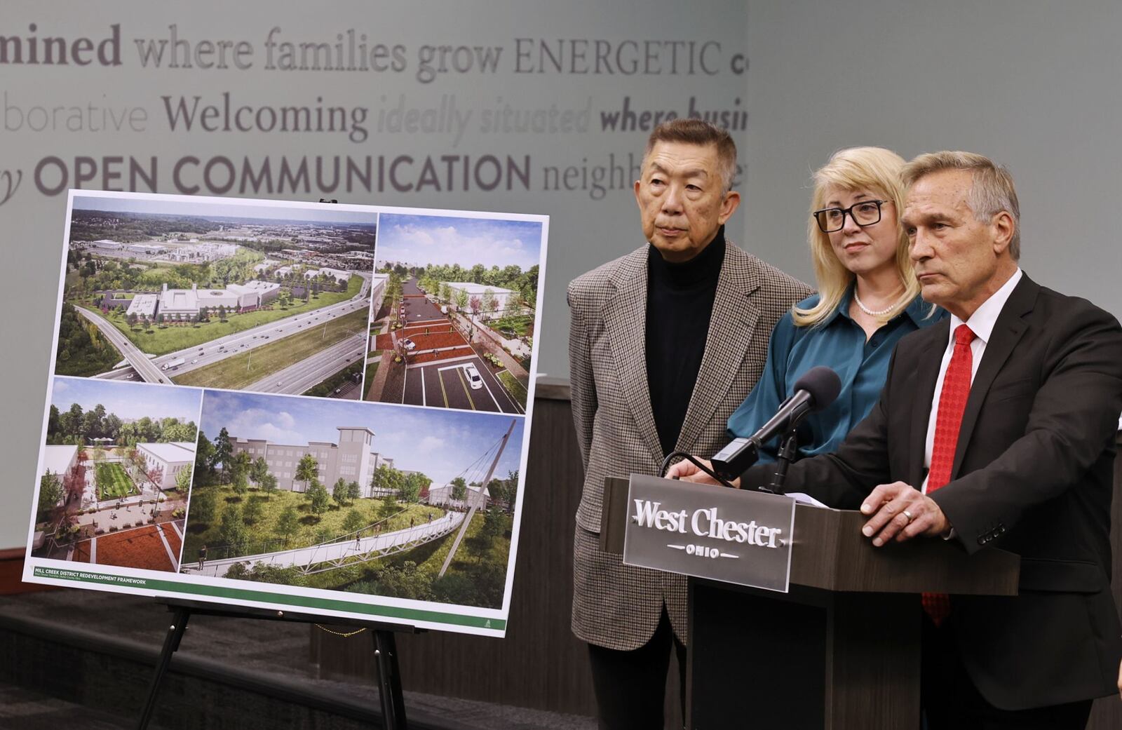West Chester Township trustees Lee Wong, left, Ann Becker and Mark Welch answer questions after the township announced the purchase of 75 acres of land east of I-75 between Union Centre Blvd. and West Chester Road for future mixed-use development and green space called The Mill Creek District. NICK GRAHAM/STAFF