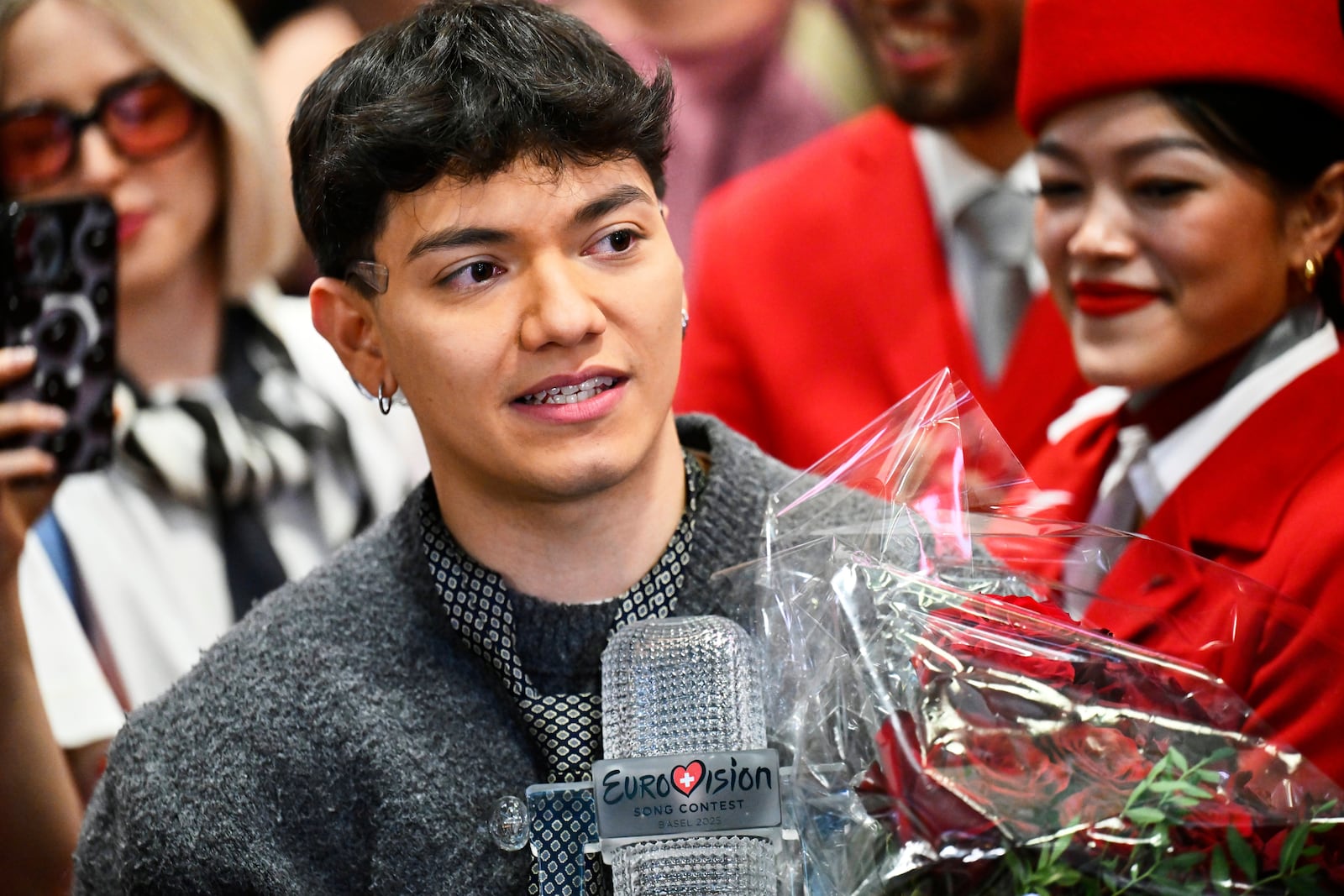 JJ, center, from Austria arrives at the airport in Vienna, Austria, Sunday, May 18, 2025, after winning the Grand Final of the 69th Eurovision Song Contest, in Basel yesterday. (AP Photo/Denes Erdos)