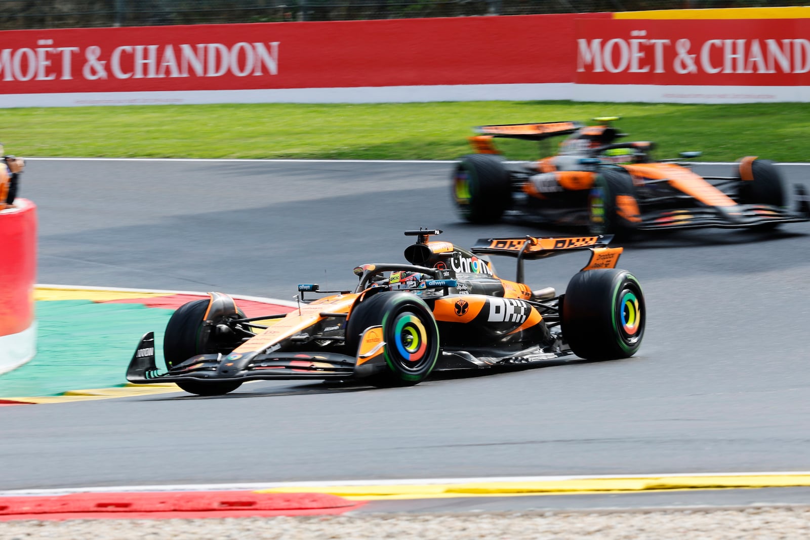 McLaren driver Oscar Piastri of Australia, left, steers his car ahead of McLaren driver Lando Norris of Britain during the Formula One Grand Prix at the Spa-Francorchamps racetrack in Spa, Belgium, Sunday, July 27, 2025. (AP Photo/Geert Vanden Wijngaert)