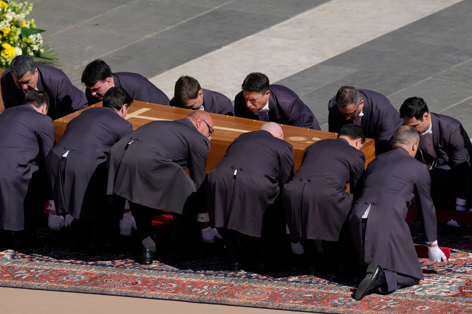 The coffin of Pope Francis is placed on the ground during his funeral in St. Peter's Square at the Vatican, Saturday, April 26, 2025. (AP Photo/Gregorio Borgia)