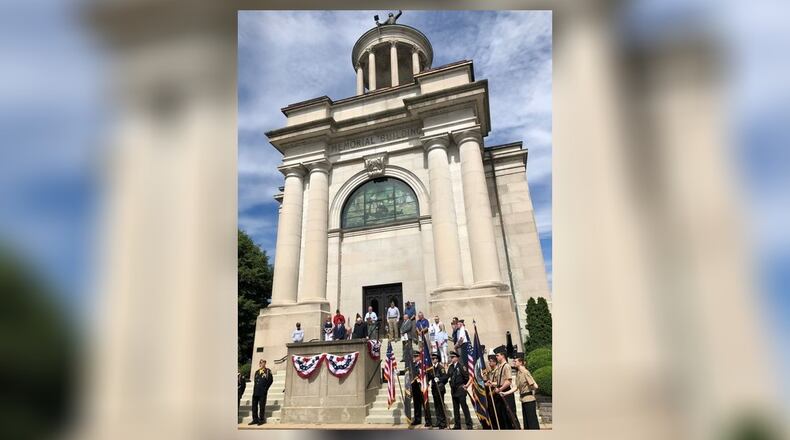 More than 100 people attended a Memorial Day service Monday morning outside the Soldiers, Sailors and Pioneers Monument in Hamilton. Hamilton Mayor Pat Moeller served as master of ceremonies and the event included six local honor guards, speeches, a 21-gun salute and the playing of Taps. RICK McCRABB/STAFF