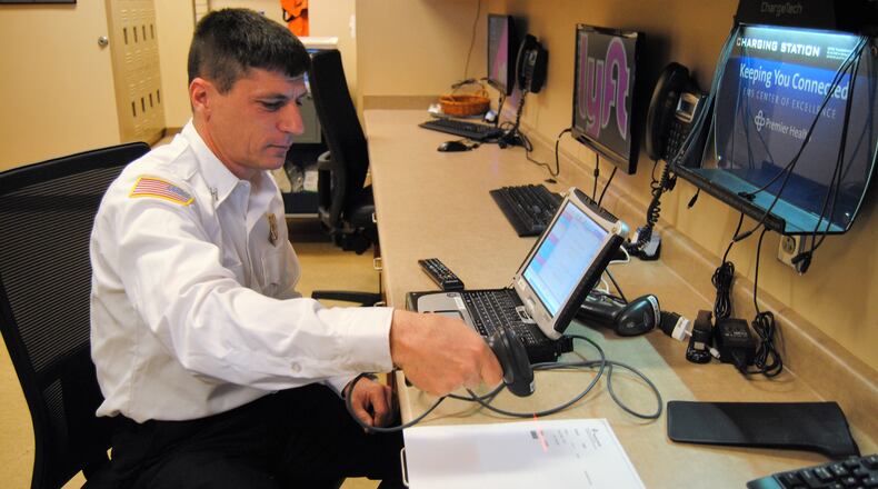 Middletown Fire Department Capt. Steve Ludwig shows how first responders arriving at Atrium Medical Center in Middletown scan and enter patient data, which is then uploaded to the cloud. From there the data is attached to a patient’s care report across the entire Premier Health system, helping hospital clinicians improve bedside decision-making. ERIC SCHWARTZBERG/STAFF