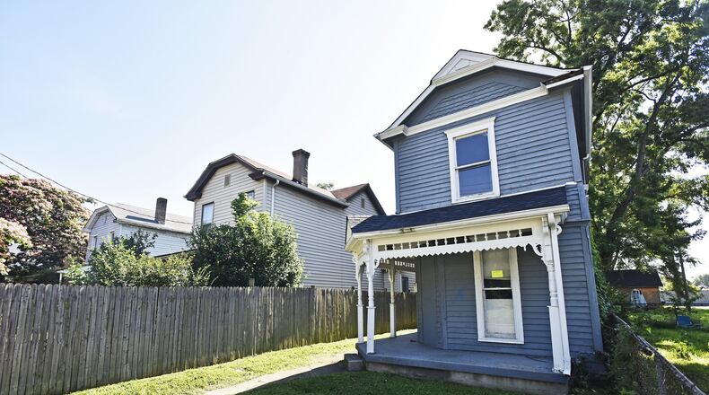 A plan that will impact hundreds of homes and businesses in hopes of spurring development and investment in Middletown’s Oakland neighborhood continues in hopes of matching historic revitalizations in other neighborhoods in southwest Ohio. Earlier this month Middletown City Council approved spending $108,006 with developers Dan Barton and Dan Mayzum of the Oakland Renaissance Incentive District to cover the costs project’s second phase to revitalize the entire neighborhood designed to attract new residents, expand the tax base and increase property values. Last week, Mayzum came upon a house built in the 1880s in the 300-block of Garfield Street that was slated for demolition. He contacted city and Butler County Land Bank officials about purchasing the house for future redevelopment and prevent its demolition. NICK GRAHAM/STAFF