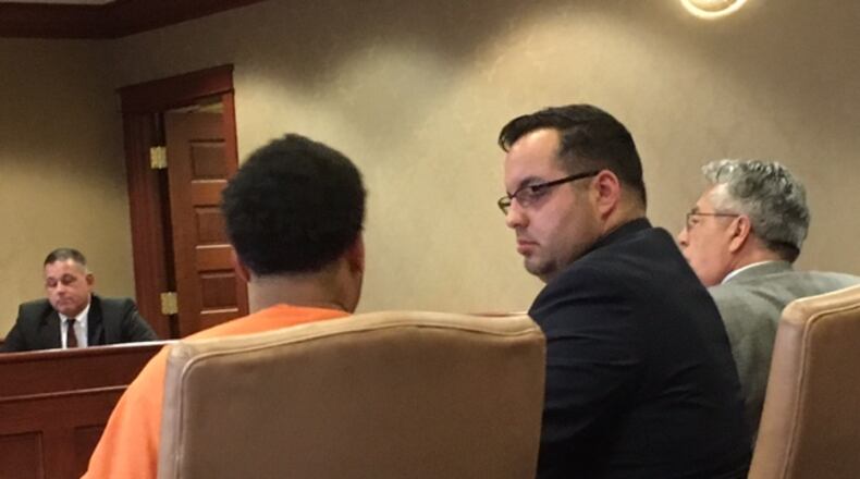 Malcolm Franklin, charged with aggravated murder and felonious assault in the deadly bar shooting at D&J Nite Spot in Middletown, talks with defense attorney Frank Schiavone IV during a hearing Tuesday in Butler County Common Pleas Court. LAUREN PACK/STAFF