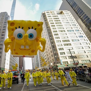 Balloon handlers guid the Sponge Bob Square Pants balloon down Sixth Avenue during the Macy's Thanksgiving Day Parade, Thursday, Nov. 27, 2025, in New York. (AP Photo/Eduardo Munoz Alvarez)