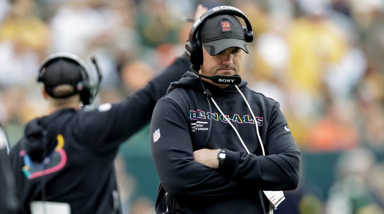 Cincinnati Bengals head coach Zac Taylor walks the sidelines in the first half of an NFL football game against the Green Bay Packers, Sunday, Oct. 12, 2025, in Green Bay, Wis. (AP Photo/Matt Ludtke)