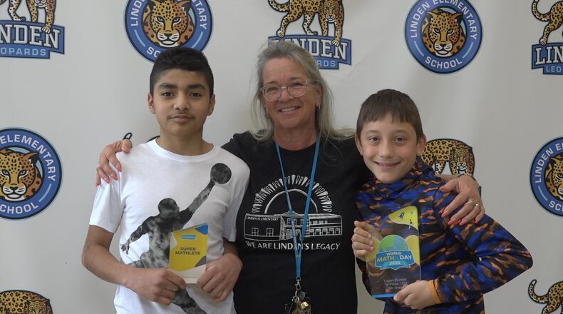 Two of America’s youngest and best mathematicians can now be found in a Butler County elementary school. In March 300,000 students from around the globe competed in online tests hosted by Mathletics. When the results for the “World Maths Day” contest were tallied, a pair of 6th graders at Hamilton Schools’ Linden Elementary finished first and second among same grade participating students in the nation.
Taking first place was Logan Wurster (right) with Linden classmate Sebastian Reynoso (left) just behind him in second place. The winners are pictured with Linden math teacher Nancy Taylor. (Provided Photo\Journal-News)