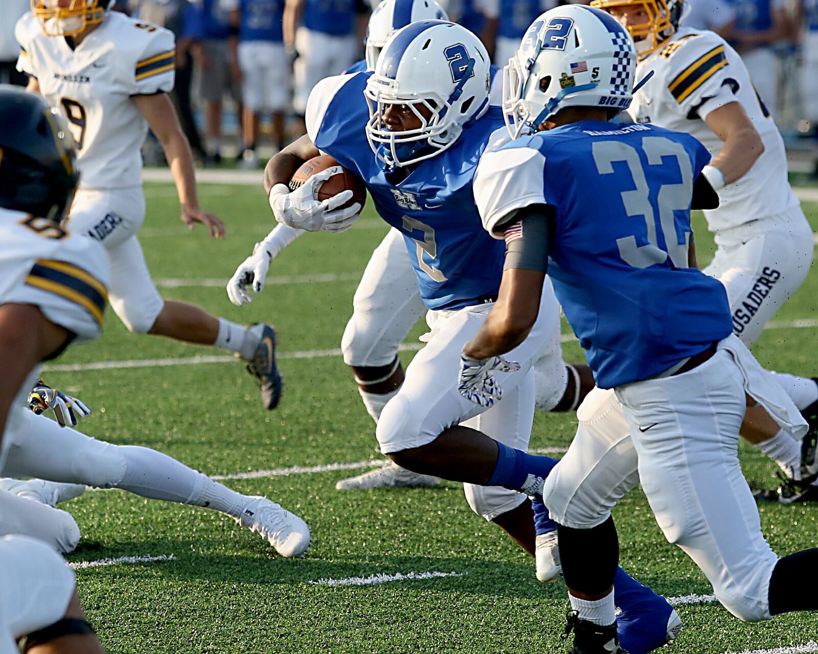Hamilton’s DaQuan Maffett carries the ball against Moeller during the Skyline Chili Crosstown Showdown at Virgil Schwarm Stadium in Hamilton on Aug. 26. The visiting Crusaders won 42-7. CONTRIBUTED PHOTO BY E.L. HUBBARD