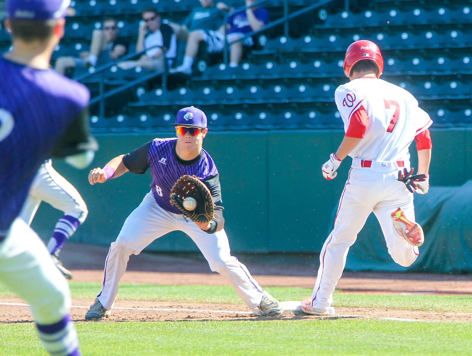 Lakota West’s Bryce Johnson (7) is called out on this play at first base Friday during a Division I state semifinal against Massillon Jackson at Huntington Park in Columbus. That’s Jackson first baseman Stone King about to catch the ball. GREG LYNCH/STAFF