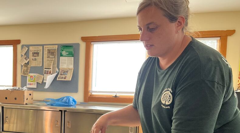 Talawanda Oxford Pantry and Social Services director Sherry Martin collects client paperwork. JILLIAN INKS/OXFORD OBSERVER