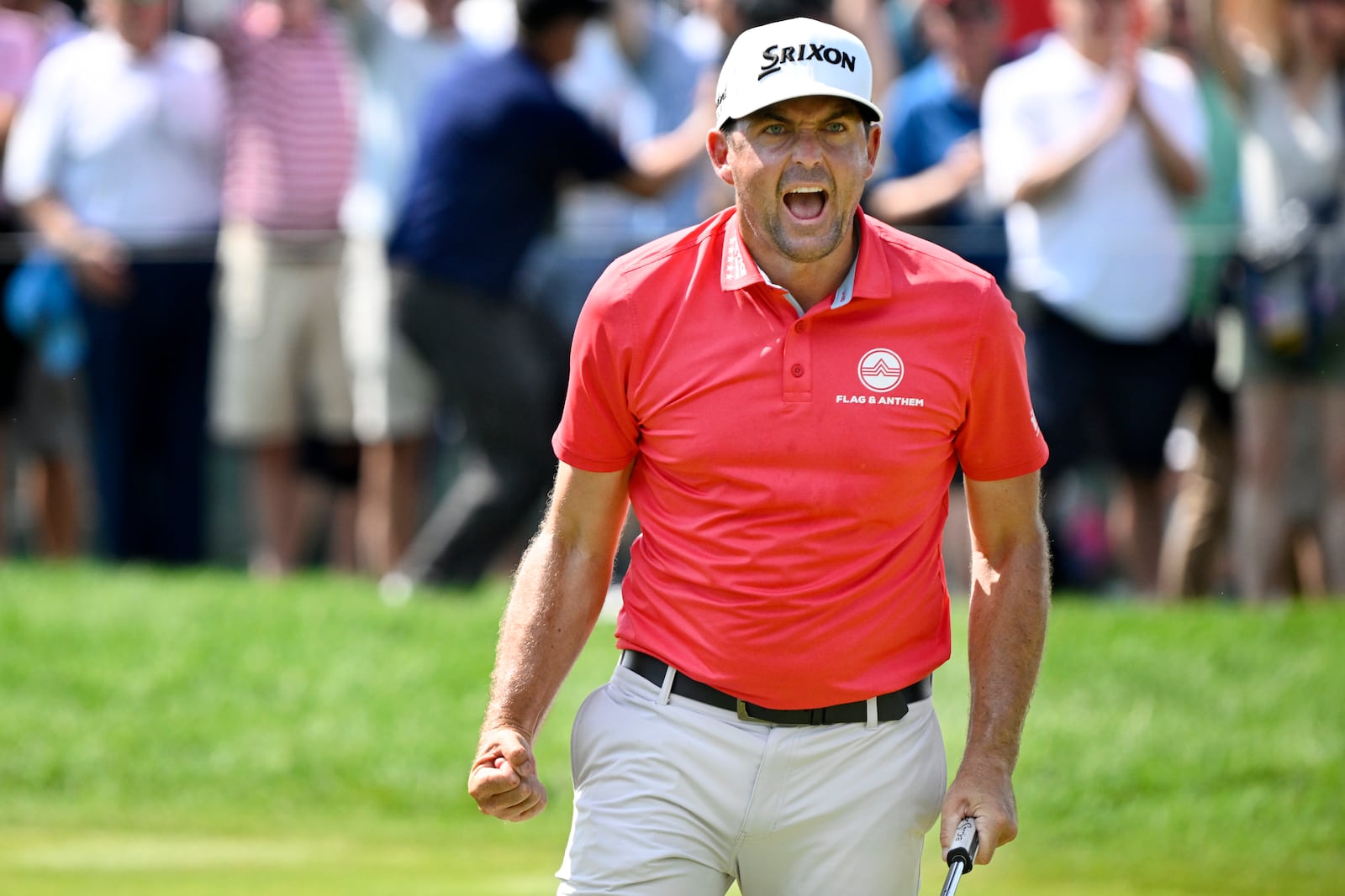 Keegan Bradley reacts to making birdie putt to a tie for the lead on the ninth hole during the final round of the Travelers Championship golf tournament at TPC River Highlands, Sunday, June 22, 2025, in Cromwell, Conn. (AP Photo/Jessica Hill)