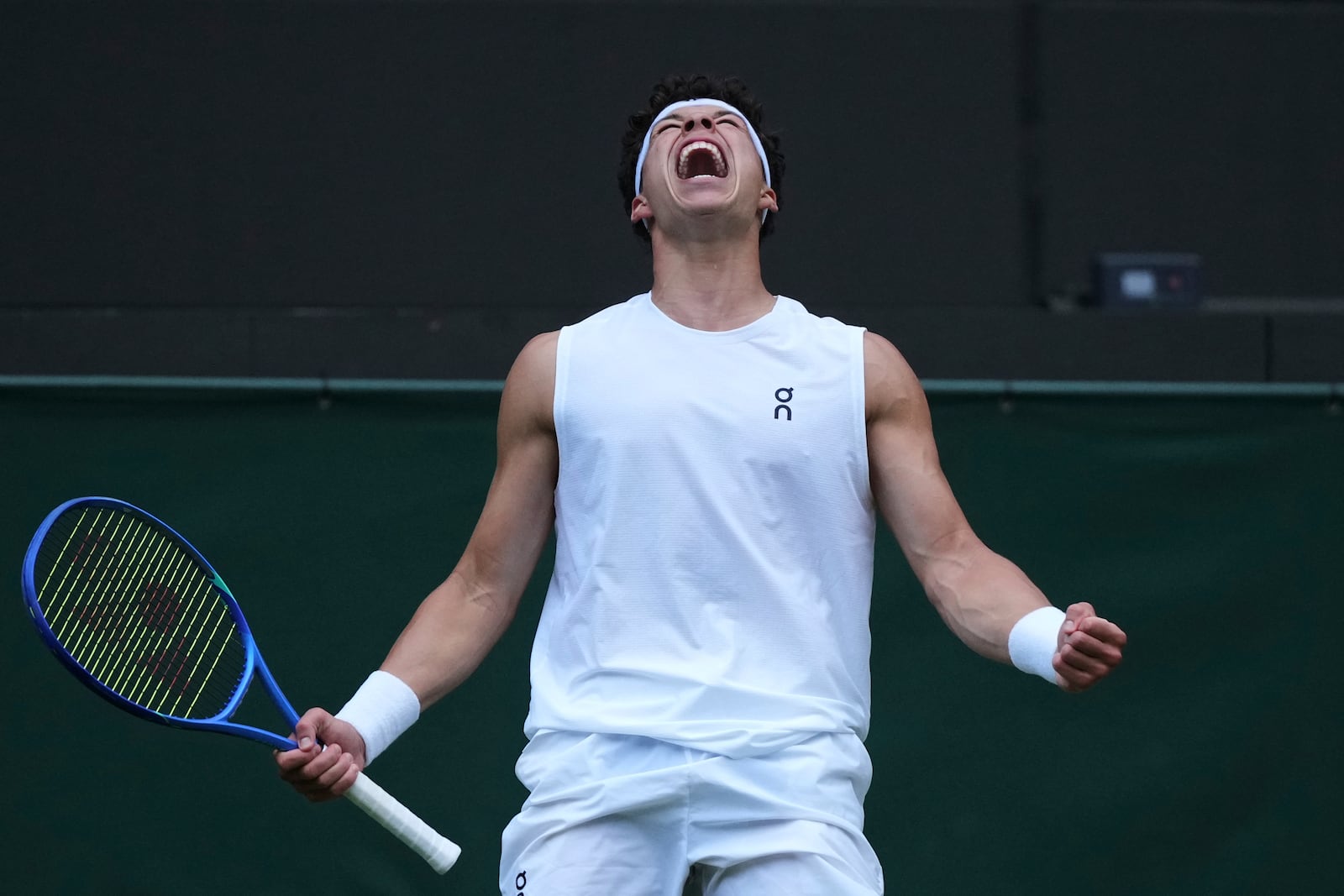 Ben Shelton of the U.S. celebrates after beating Marton Fucsovics of Hungary during their men's singles third round match at the Wimbledon Tennis Championships in London, Saturday, July 5, 2025.(AP Photo/Alastair Grant)