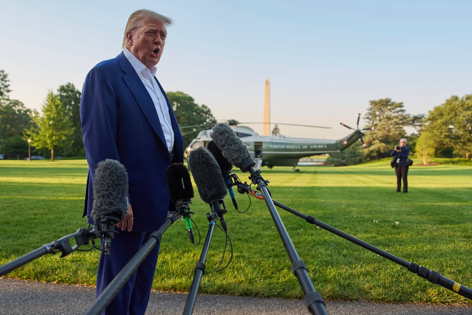 President Donald Trump speaks with reporters before boarding Marine One on the South Lawn of the White House, Tuesday, June 24, 2025, in Washington. (AP Photo/Evan Vucci)
