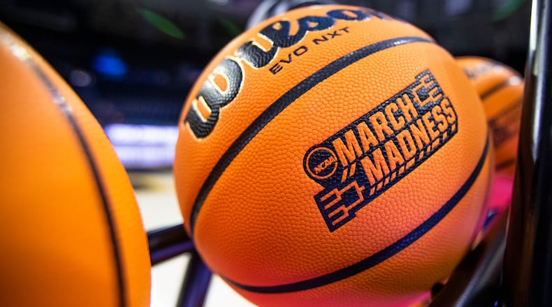 FILE - A basketball with a March Madness logo rests on a rack before a First Four game between Illinois and Mississippi State in the NCAA women's basketball tournament Wednesday, March 15, 2023, in South Bend, Ind. (AP Photo/Michael Caterina, File)