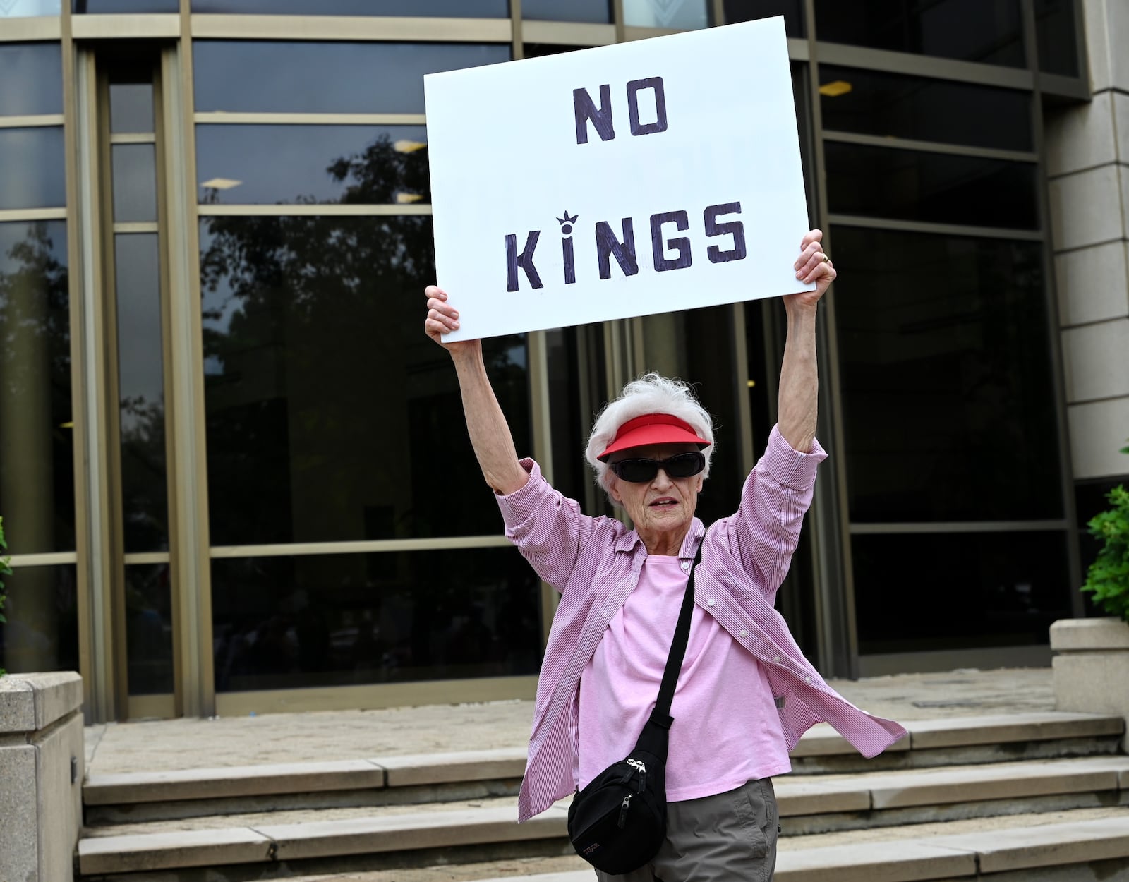 More than 300 people from the region ascended onto One Renaissance Center at the corner of Martin Luther King Jr. Boulevard and High Street in Hamilton to protest President Donald Trump on his policies and what many called his "political overreach." On this day, Saturday, June 14, 2025, is the president's 79th birthday and a military parade he wanted organized. MICHAEL D. PITMAN/STAFF