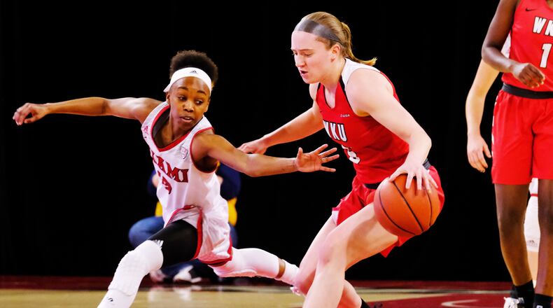 Miami University’s Lauren Dickerson defends Western Kentucky’s Whitney Creech during a WNIT game at in March, 2019, at Millett Hall in Oxford. WKU won 67-63. SCOTT KISSELL/MIAMI UNIVERSITY