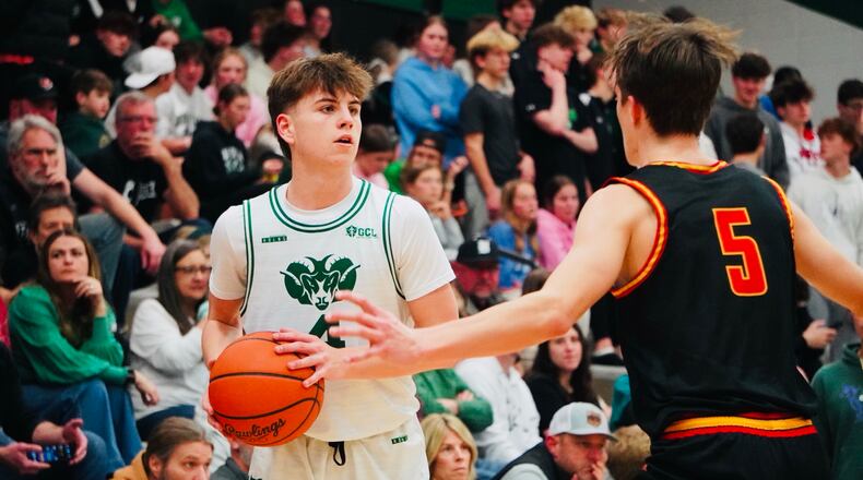 Badin’s Eli Stroud (4) looks for a passing lane and is guarded by Fenwick's Will Lenz (5) at Mulcahey Gym on Friday. Chris Vogt/CONTRIBUTED
