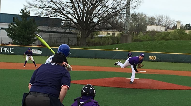 Middletown pitcher Gene Underhill sends a pitch toward his catcher, Kelvin Shealey, and Ernest Wolke of Winton Woods during Sunday’s Skyline Chili Reds Futures Showcase game at the Reds Urban Youth Academy in Roselawn. RICK CASSANO/STAFF