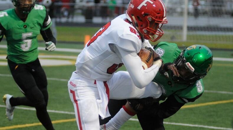 Fairfield TE Erick All (with ball) and Northmont's Danny Lewis. Northmont defeated visiting Fairfield 28-21 in a Week 2 high school football game on Friday, Sept. 1, 2017. MARC PENDLETON / STAFF
