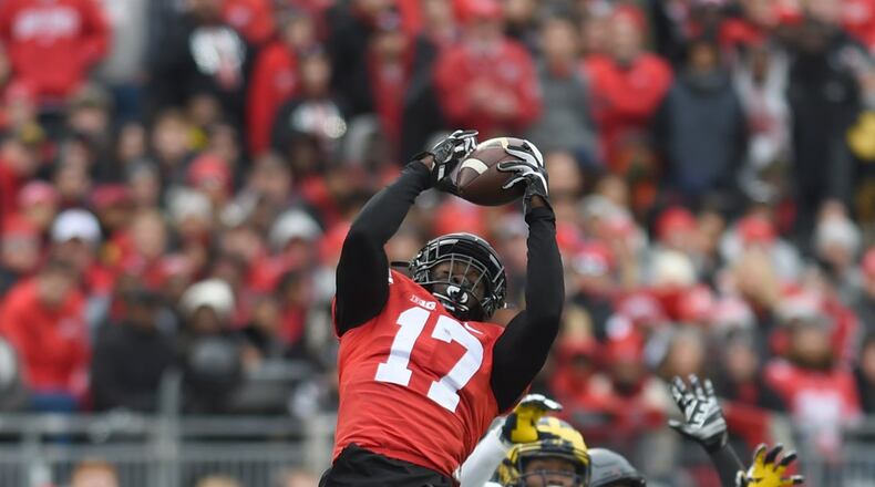 Ohio State linebacker Jerome Baker makes a leaping interception during the Buckeyes 30-27 win over Michigan on Saturday Nov. 26, 2016.